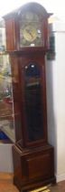 A three train Grandfather clock with arch dial and