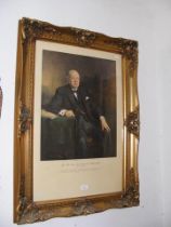A framed and glazed coloured print of Sir Winston