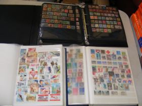 Four albums of collectable stamps GB and other