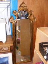 A decorative gilt hall mirror