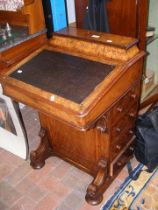 A Victorian walnut Davenport desk with drawers to