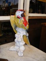 A 44cm high Continental porcelain parrot