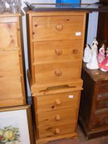 A pair of three drawer pine bedside chests