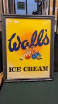 A vintage metal Wall's Ice Cream sign - framed