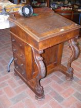 An antique Victorian Davenport desk with drawers t