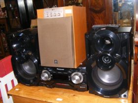 A Panasonic SA-AKX400 Stereo System, together with