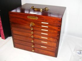 An eleven tray brass mounted mahogany coin collect