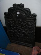 An old heavy cast iron 'Kingsworthy Foundry Neptune' fire back - 75cms high