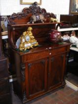 A Victorian mahogany chiffonier with shaped back