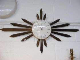 A retro sunburst wall clock