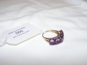 A 9ct amethyst dress ring - approx. size P