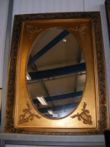 A decorative gilt wall mirror