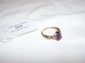 An amethyst and diamond ring in 9ct setting - appr