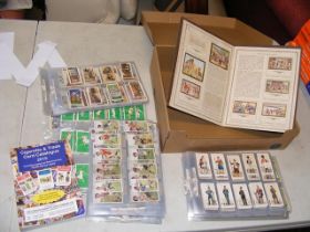 A large collection of vintage cigarette cards, set
