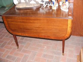 A 19th century mahogany Pembroke table on square t