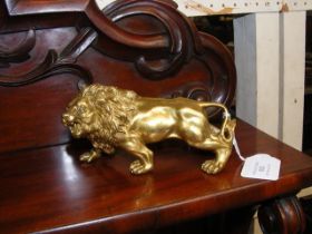 A 15cm long gilt metal lion