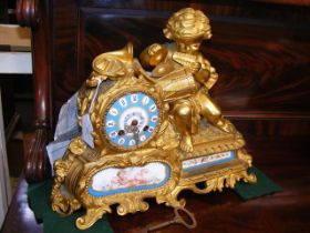 A 19th century French ormolu and porcelain clock w