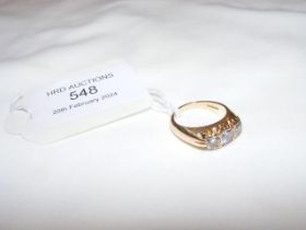 A three stone diamond ring in 18ct setting - appro