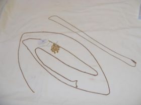 A gold brooch with 9ct watch chain and others