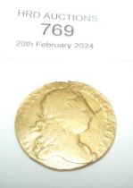 A gold George III guinea