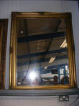 A large gilt wall mirror