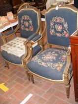 A pair of decorative antique French armchairs with