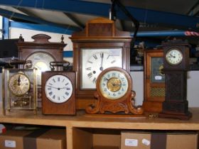 An antique mantel clock together with others