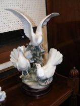 A large Lladro figural group of Doves - 58cm high
