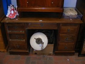 An antique seven drawer pedestal desk