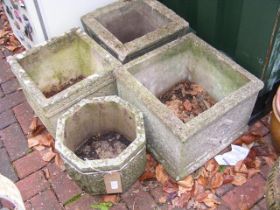 Four concrete garden planters - varying shape and