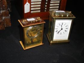 A brass cased carriage clock together with a bedsi