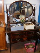 A Victorian mahogany dressing chest with oval swin