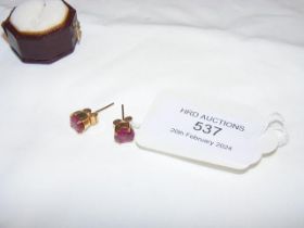 A pair of ruby? earrings in gold mount