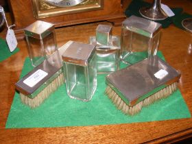 A silver dressing table set