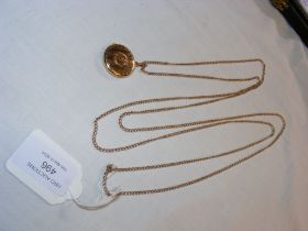 A 15ct gold pendant on 9ct gold chain