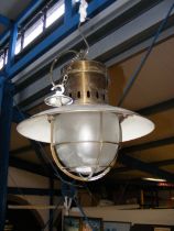 A brass and enamel ceiling light, possibly from a