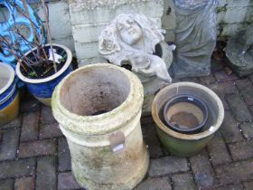 A garden urn, plant pots, terracotta chimney pot a