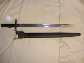 An American Remington bayonet with leather scabbar