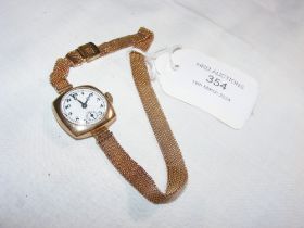 A ladies vintage 9ct watch and strap