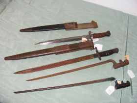 An assortment of four vintage bayonets