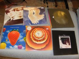 A selection of vinyl records including The Luminee