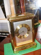 A four glass mantel clock - 26cms high by Rapport