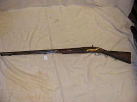 An antique percussion rifle with ramrod - overall len