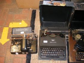 An Adler typewriter together with a Mignon typewri