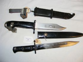 A Second World War bayonet with metal scabbard and