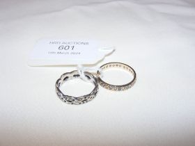 A decorative dress ring and one other