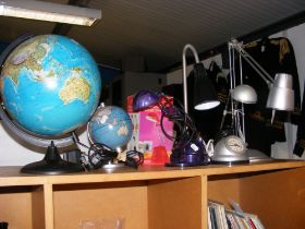 An assortment of desk lamps and light-up desk glob