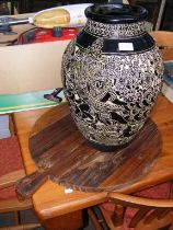 A large Indochina floor vase with glazed black det