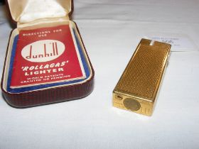 A Dunhill vintage lighter with original case and m