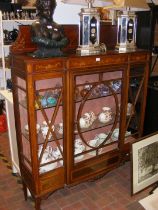 An Edwardian display cabinet with hand painted flo